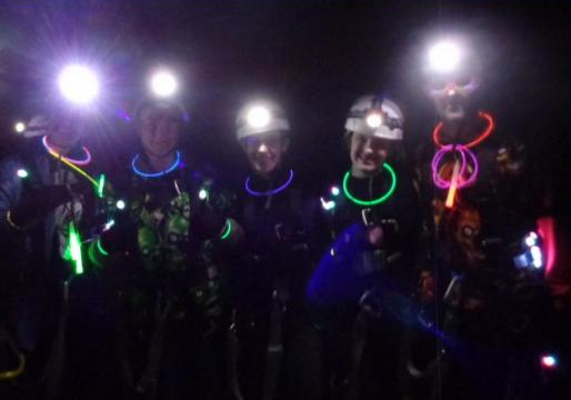 Kids with head lamps and glow sticks